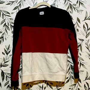 Selling my large red Zara sweater because it no longer fits my style.